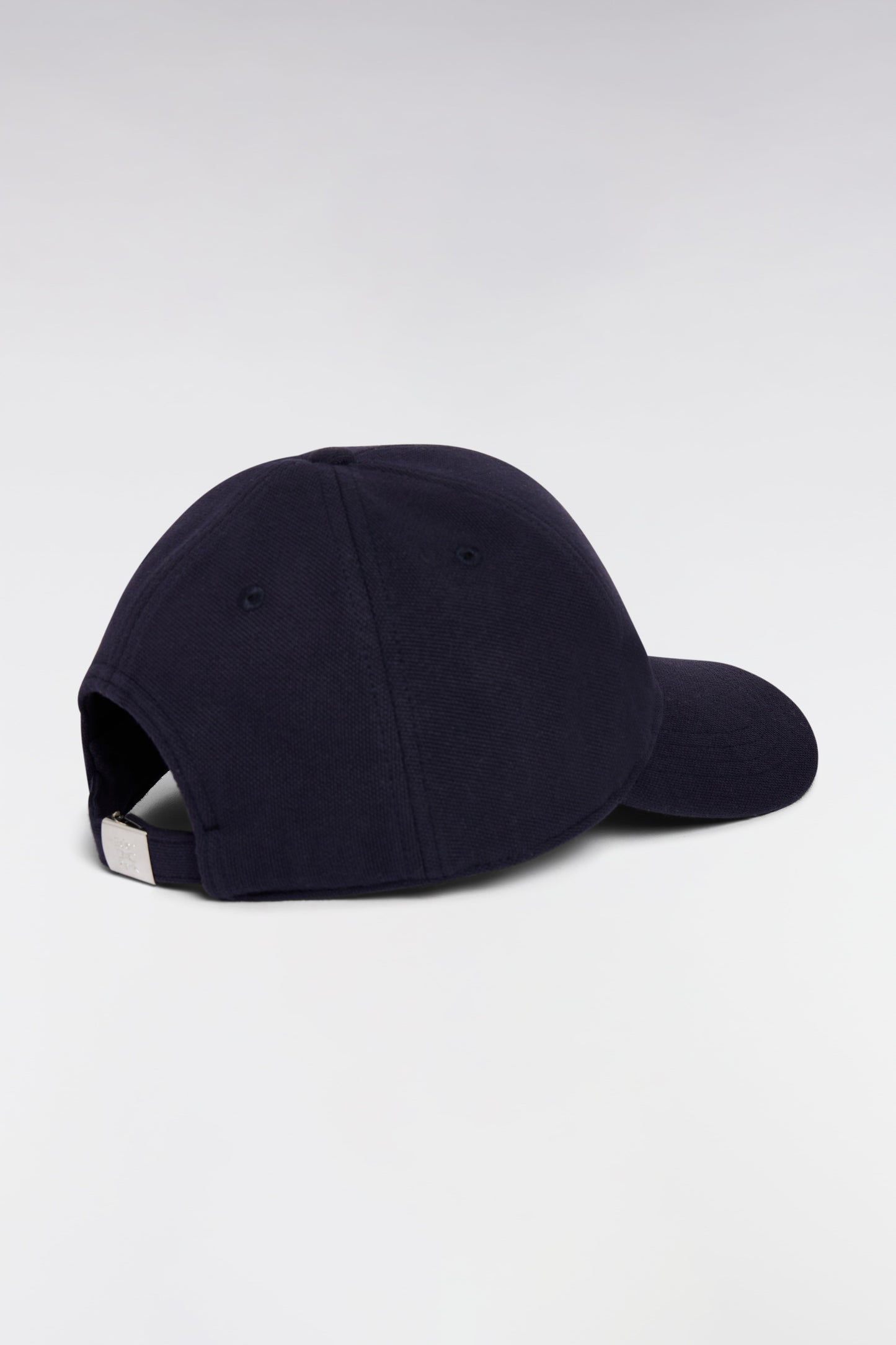 Casquette unie en piqué coton marine broderie nœud papillon