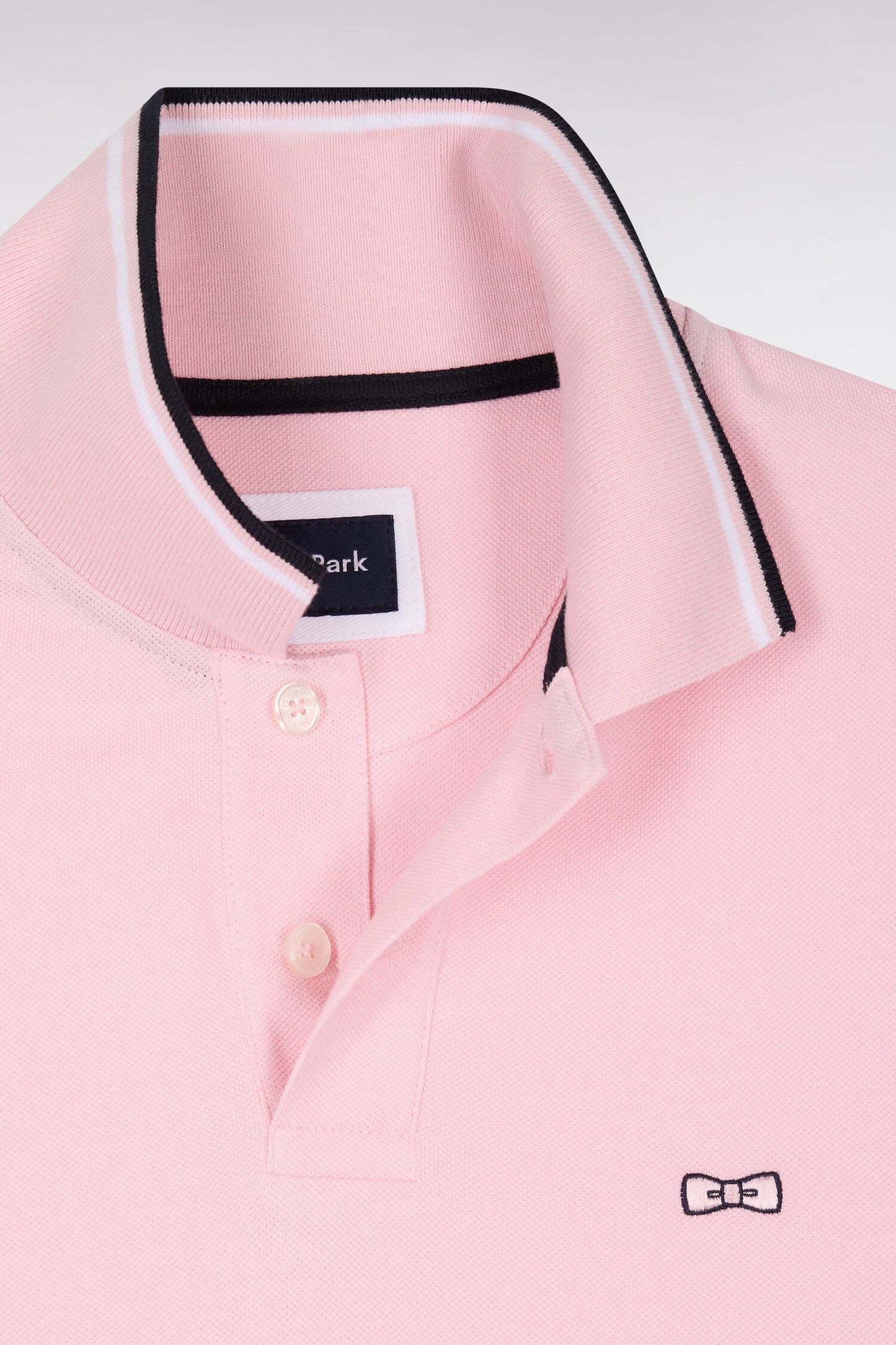 Polo à manches courtes en coton rose détails rayés coupe regular