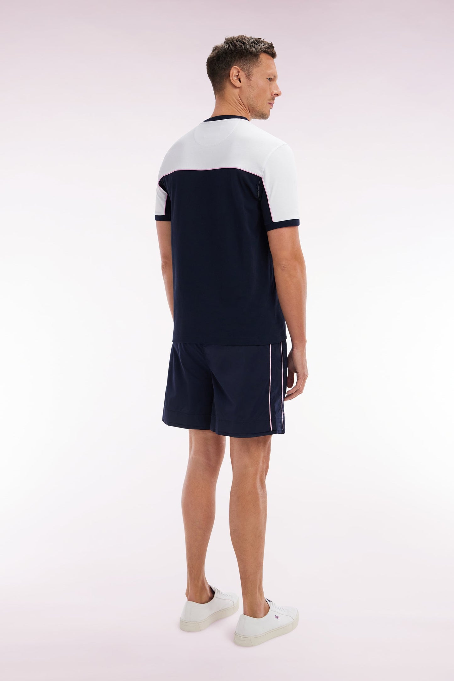 Maillot de bain marine à passepoil rose
