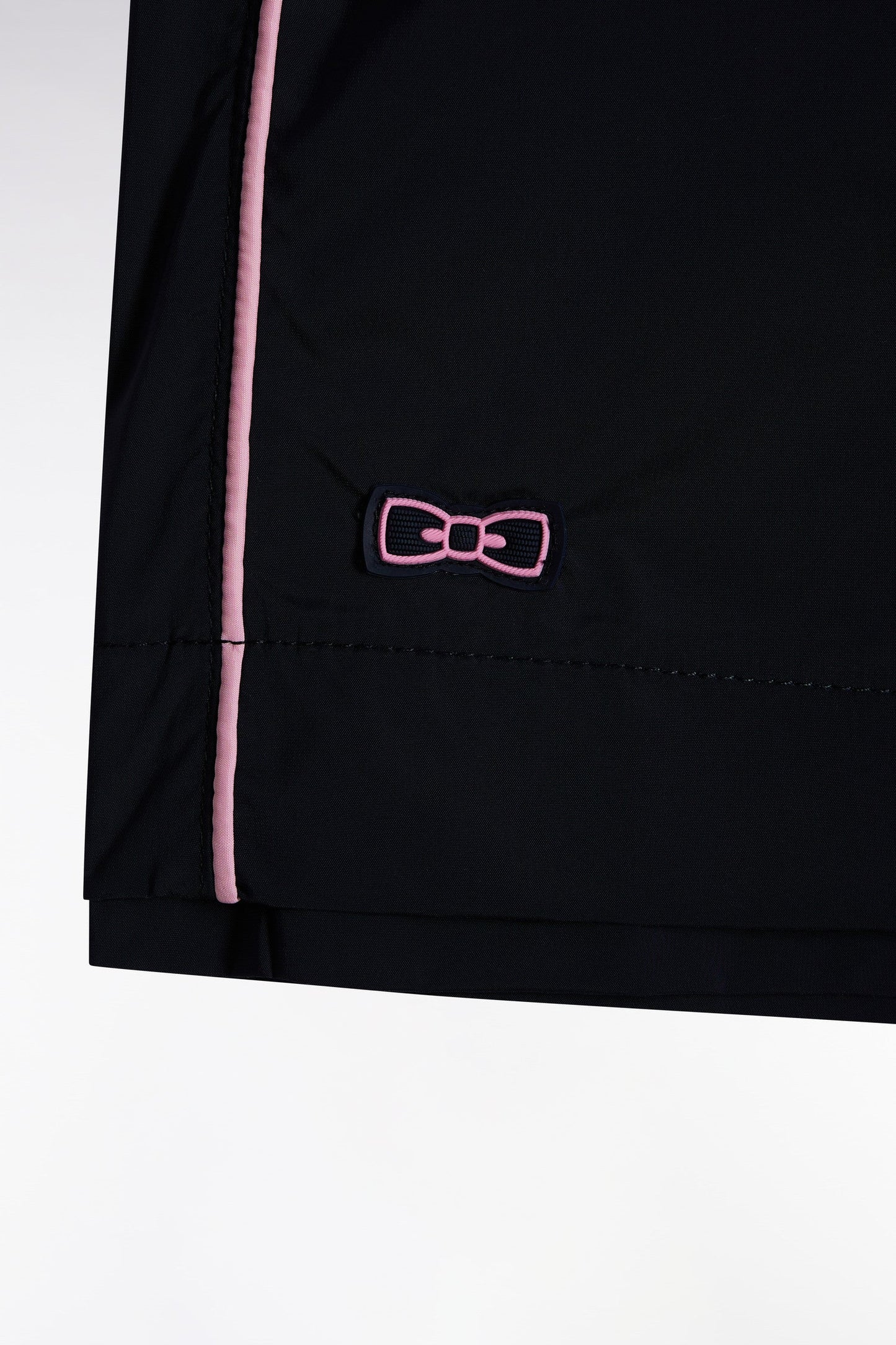 Maillot de bain marine à passepoil rose