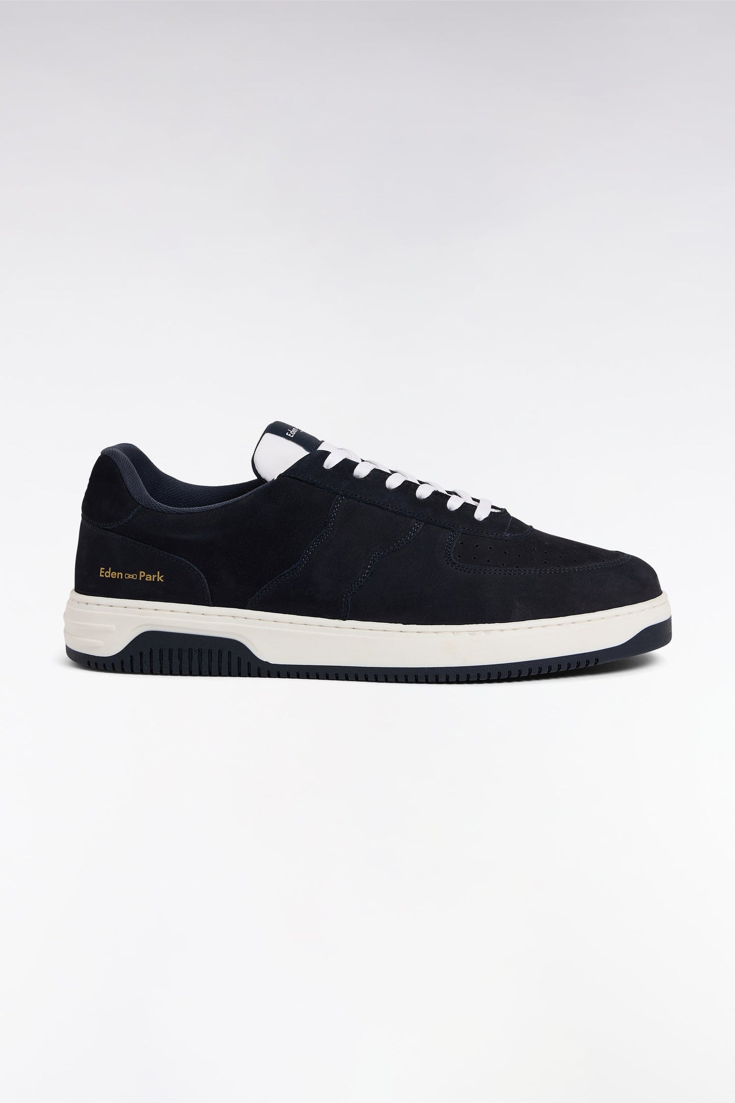 sneakers en cuir marine à semelles blanches