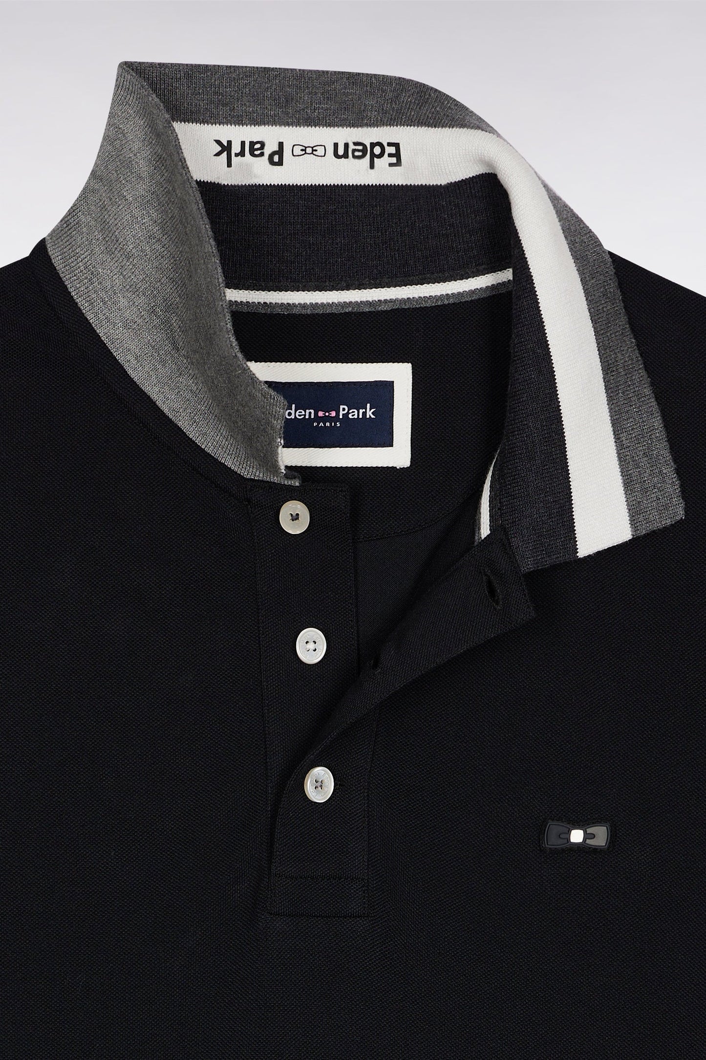 Polo manches courtes en coton noir détails tricolores coupe ample