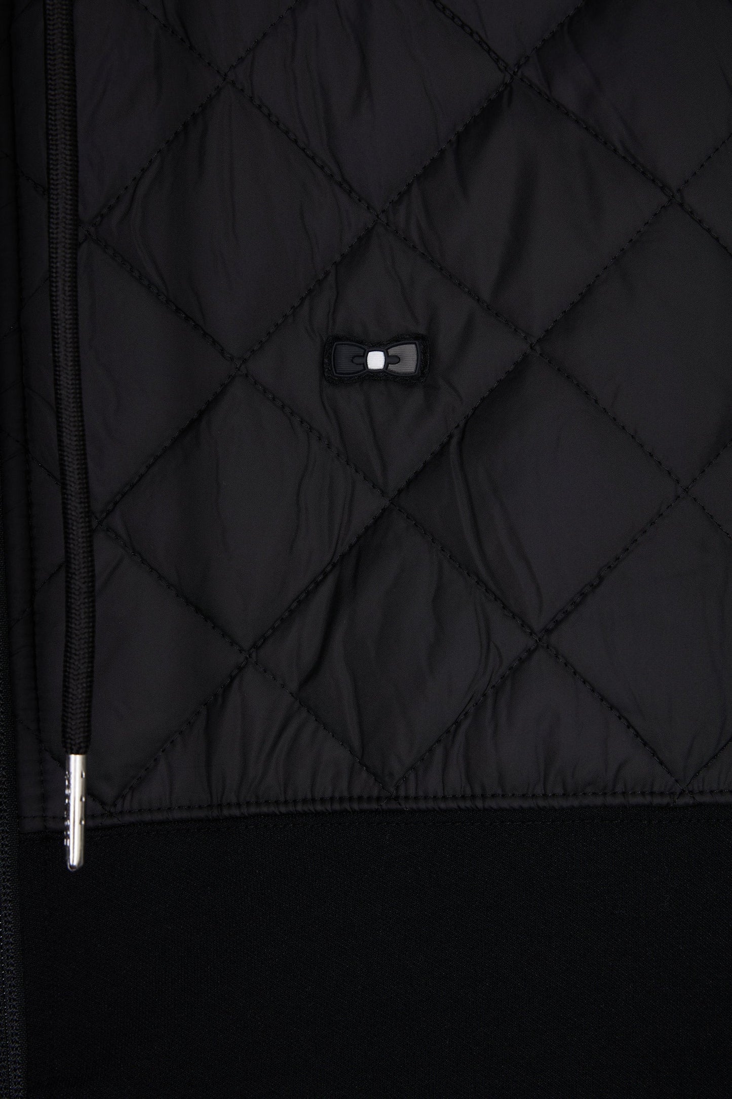 Sweatshirt zippé en interlock bimatière matelassé noir et gris